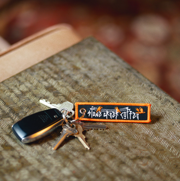 UNTETHERED EMBROIDERED KEYCHAIN