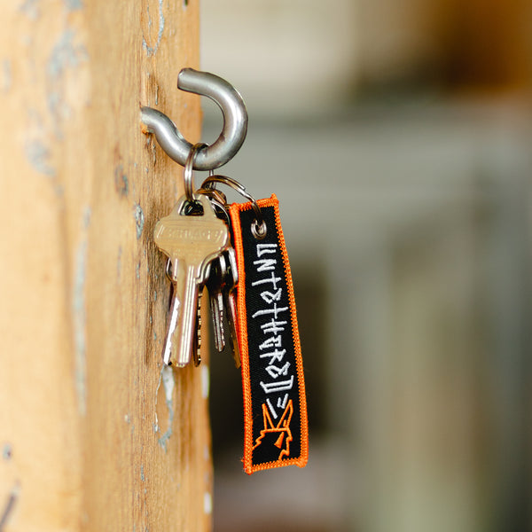 UNTETHERED EMBROIDERED KEYCHAIN