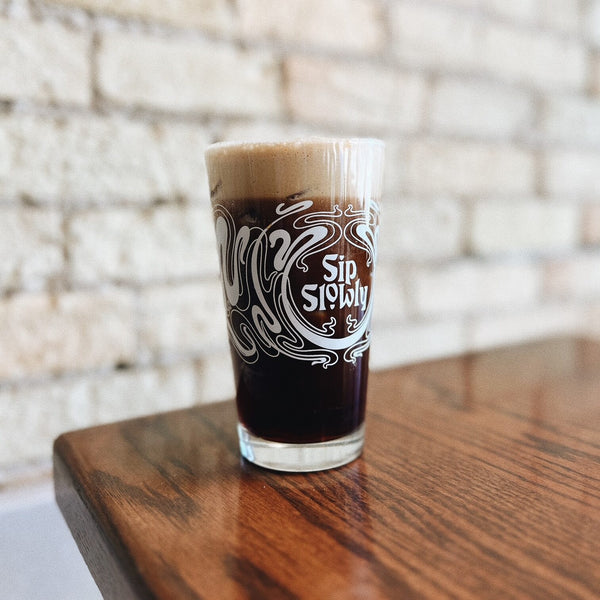 Sip Slowly Pint Glass with cold brew