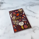 Flora & Frog Journal on table